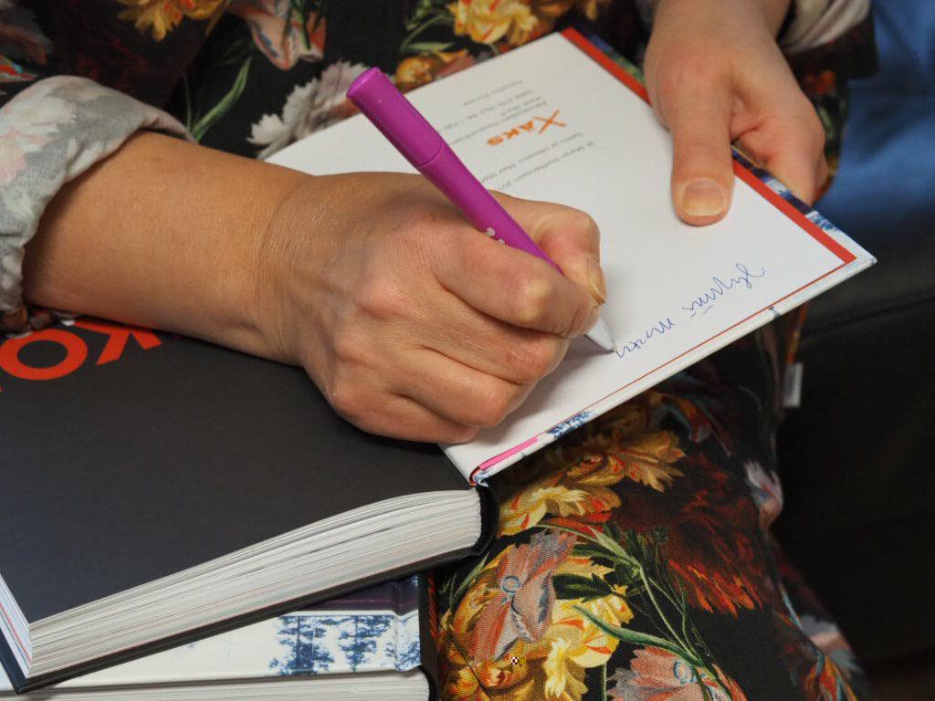 Marjo Steffansson signing her work