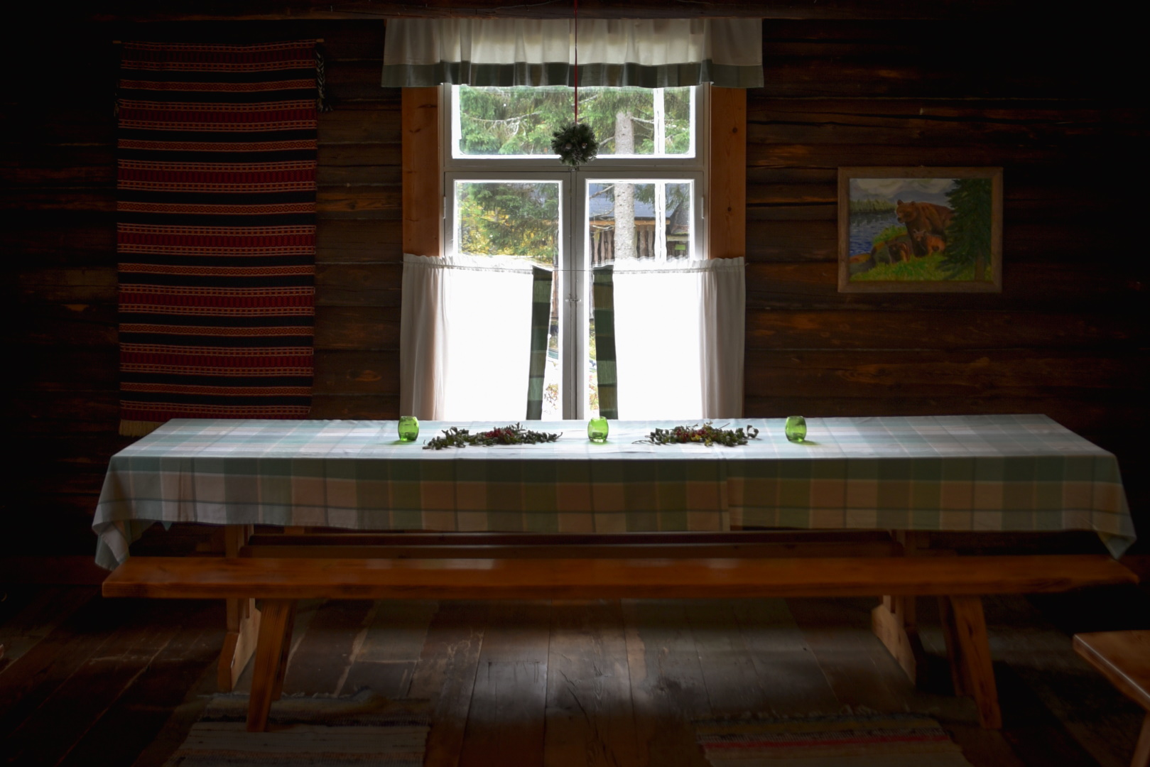 A table in the banquet hall in front of the window.