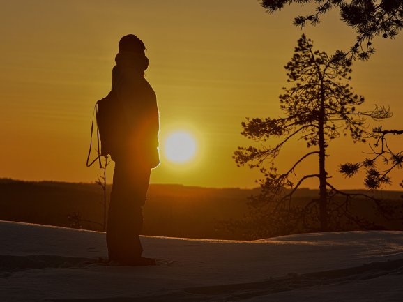 Backlit hiker.